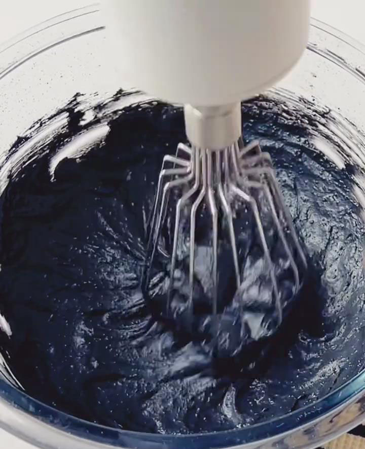 In a chilled bowl, whip heavy cream, sugar, and bamboo charcoal powder on medium speed