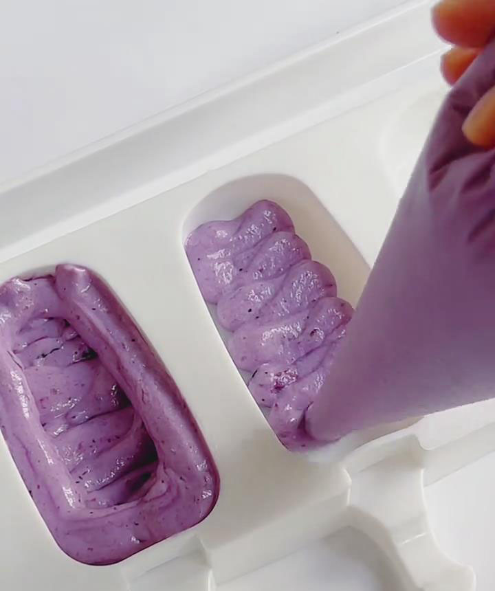 Pipe the mixture into popsicle molds until halfway full new