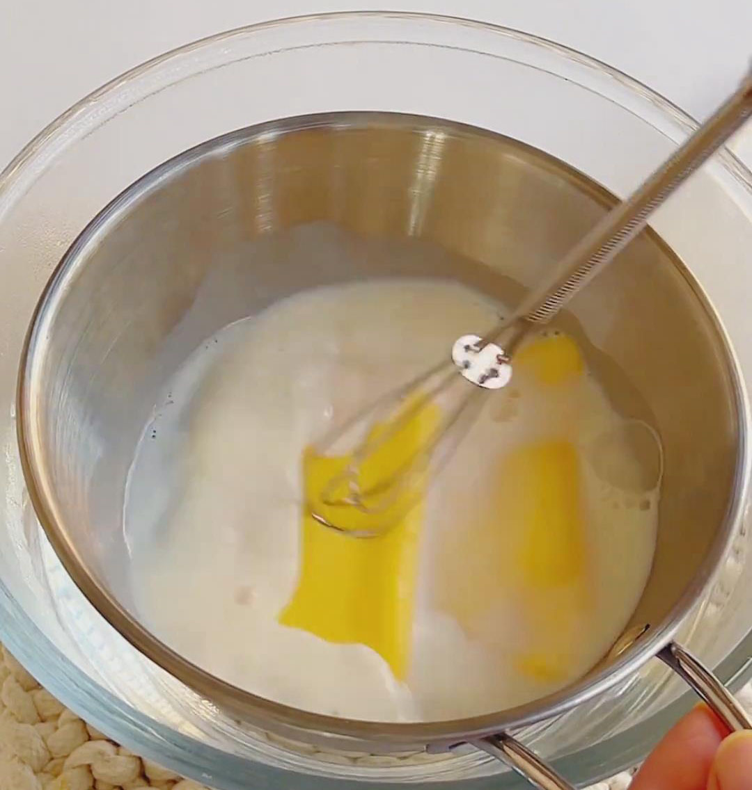 Heat 40g milk and 2 cheese slices over double boiler