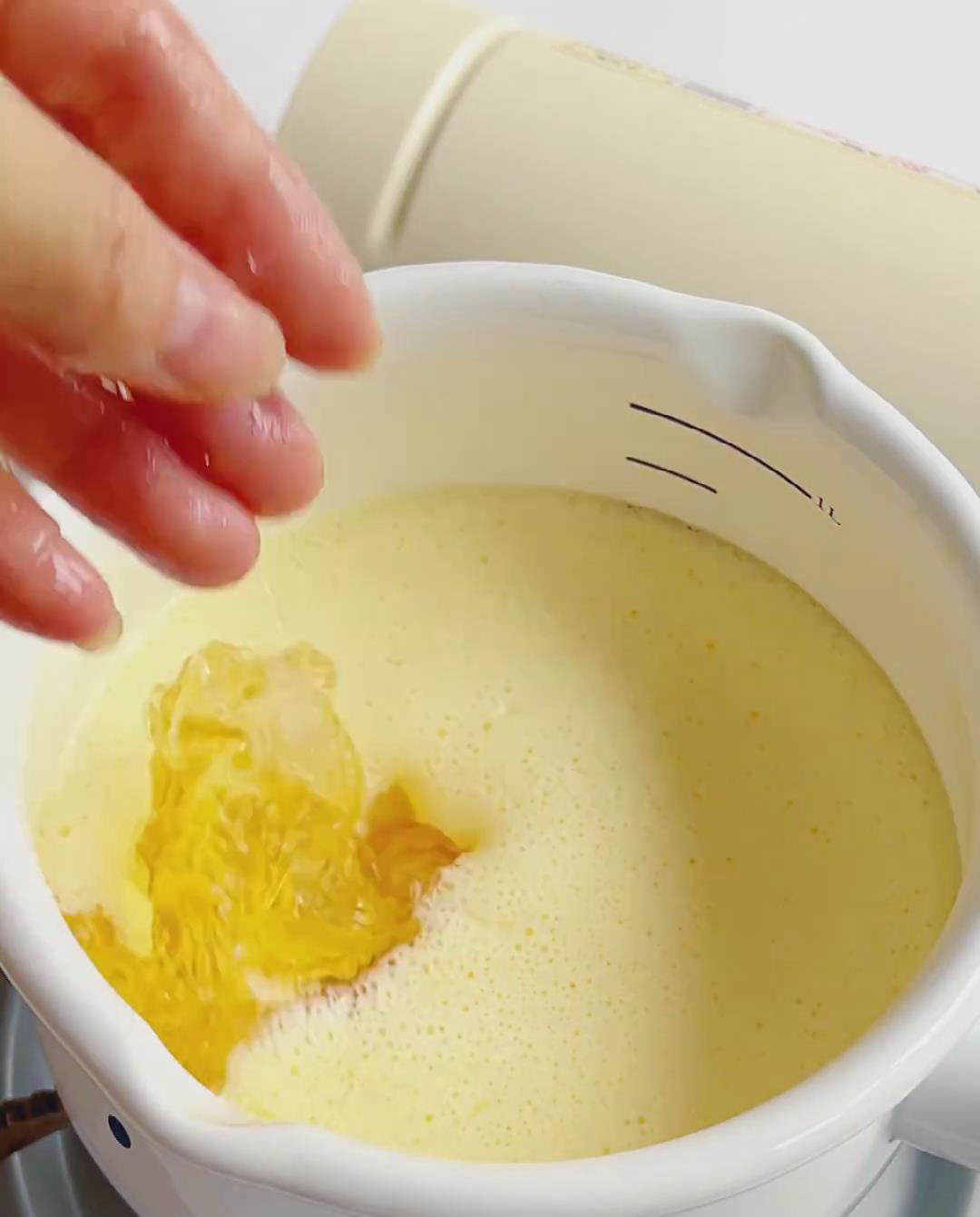 Squeeze the water out of the softened gelatin sheets and add them to the warm egg milk mixture