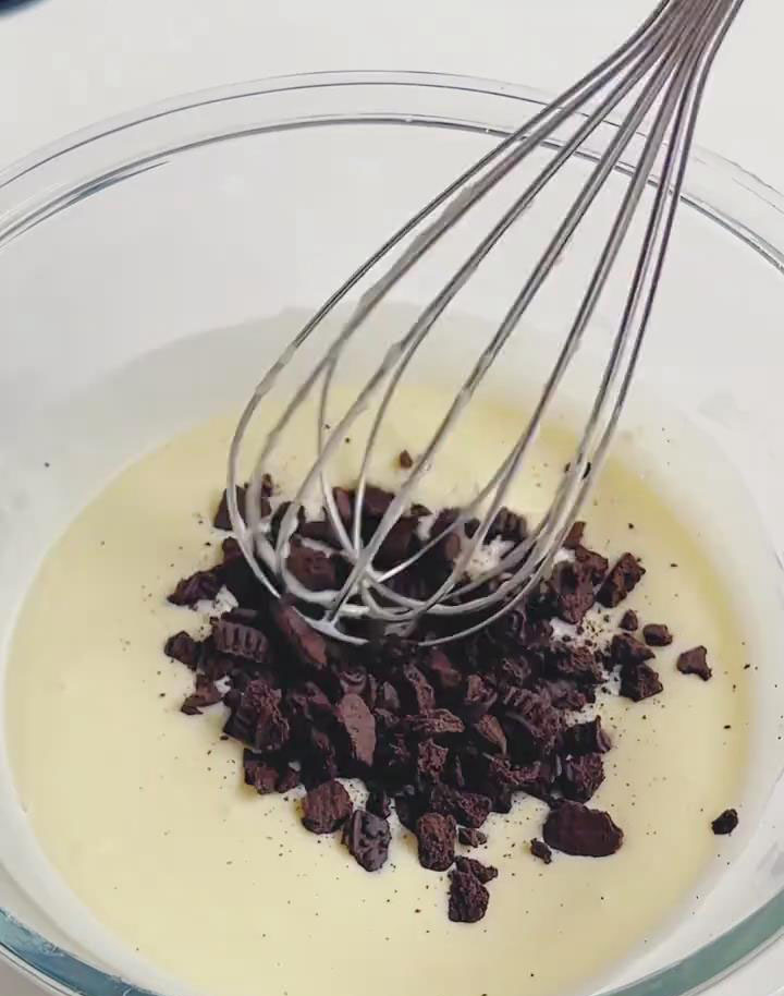 Stir 35 g Oreo crumbs into the remaining batter