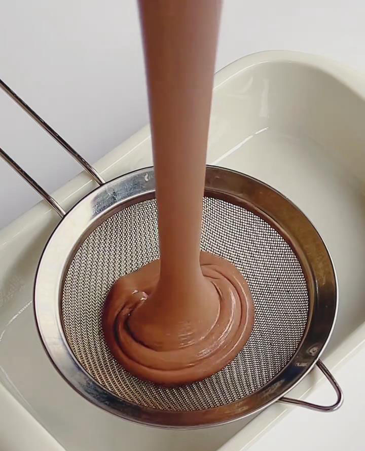 Strain the batter into a heatproof container