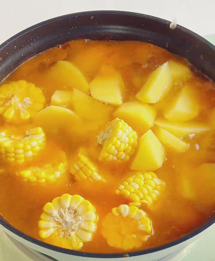 Add corn, potato, and mushrooms. Stir gently.