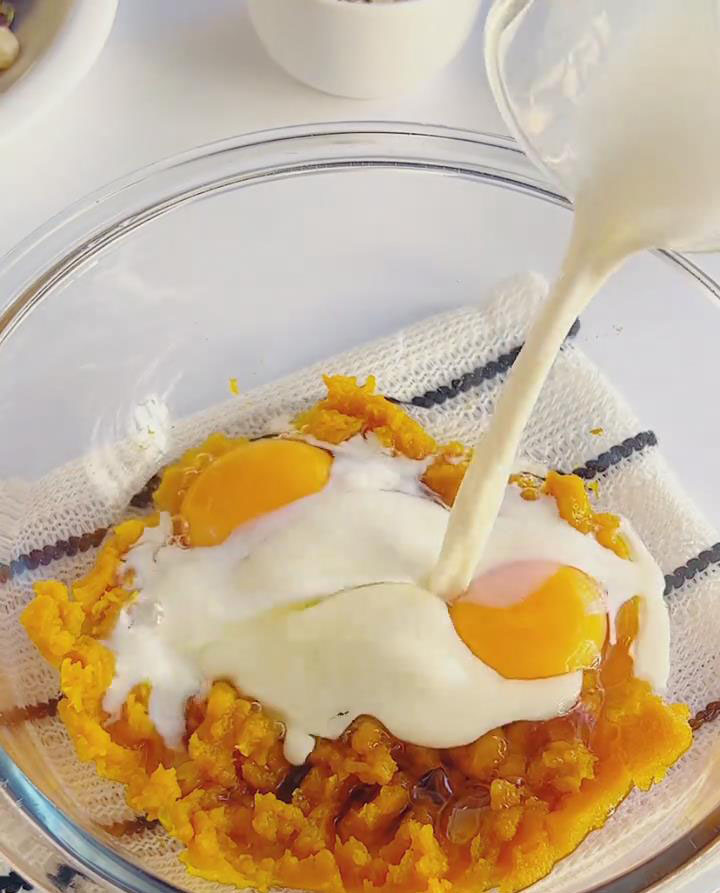 Add the 2 room temperature eggs to the bowl. Pour in the 70g of whole milk