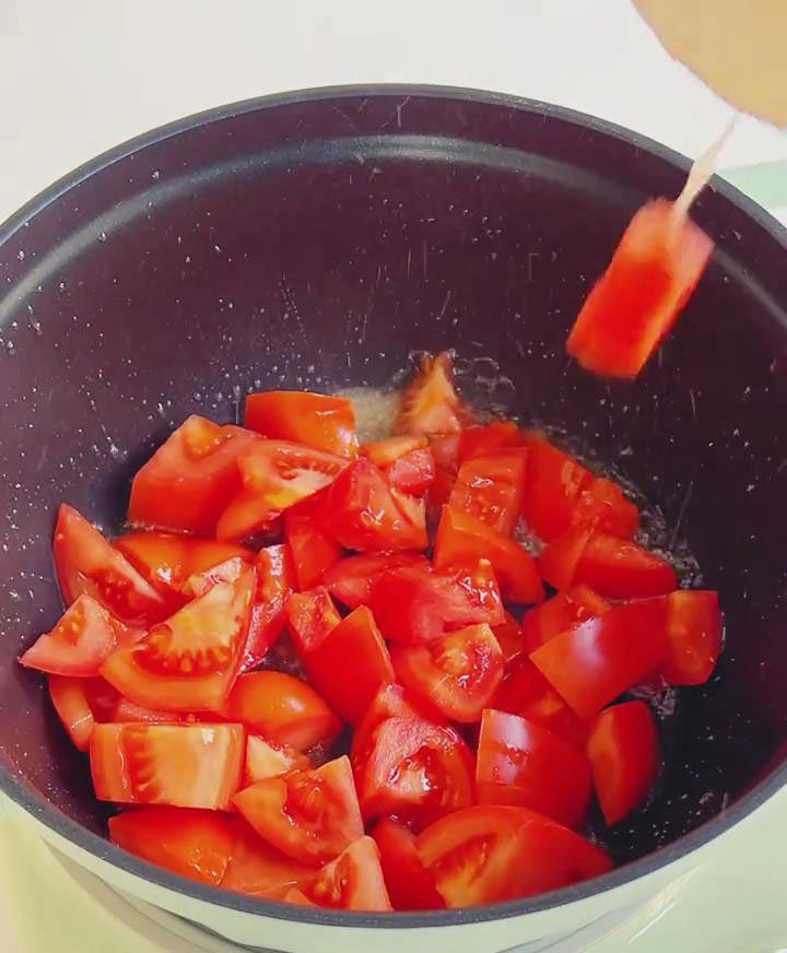 Add the chopped tomatoes and cook