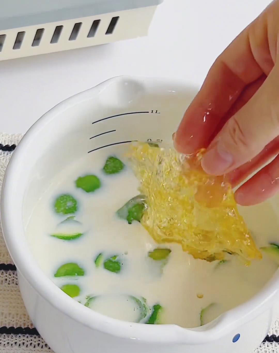 Add the softened gelatin to the warm milk mixture