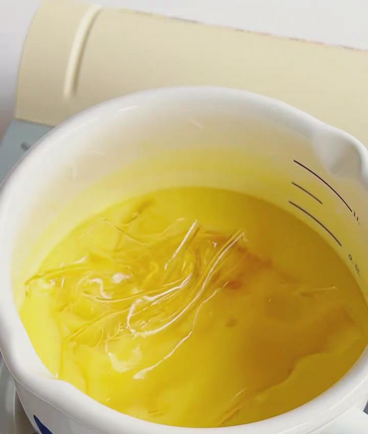 Add the softened, squeezed out gelatin sheets to the warm chocolate mixture