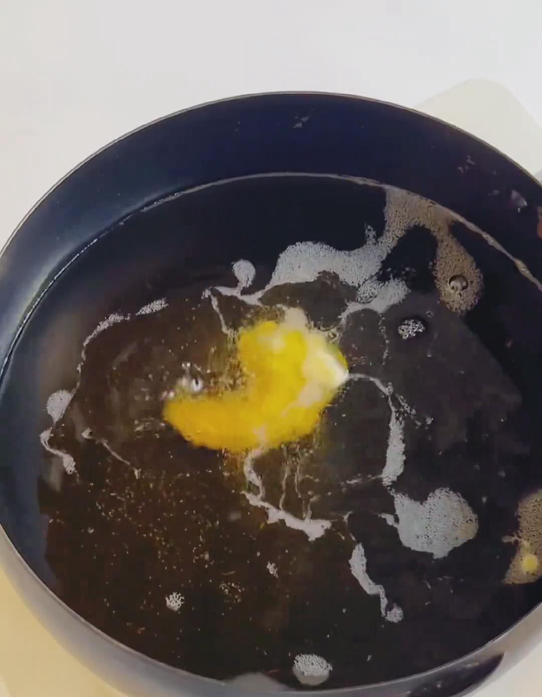 Carefully place the battered shrimp into the hot oil