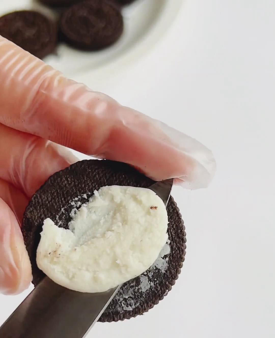Carefully twist apart the Oreos
