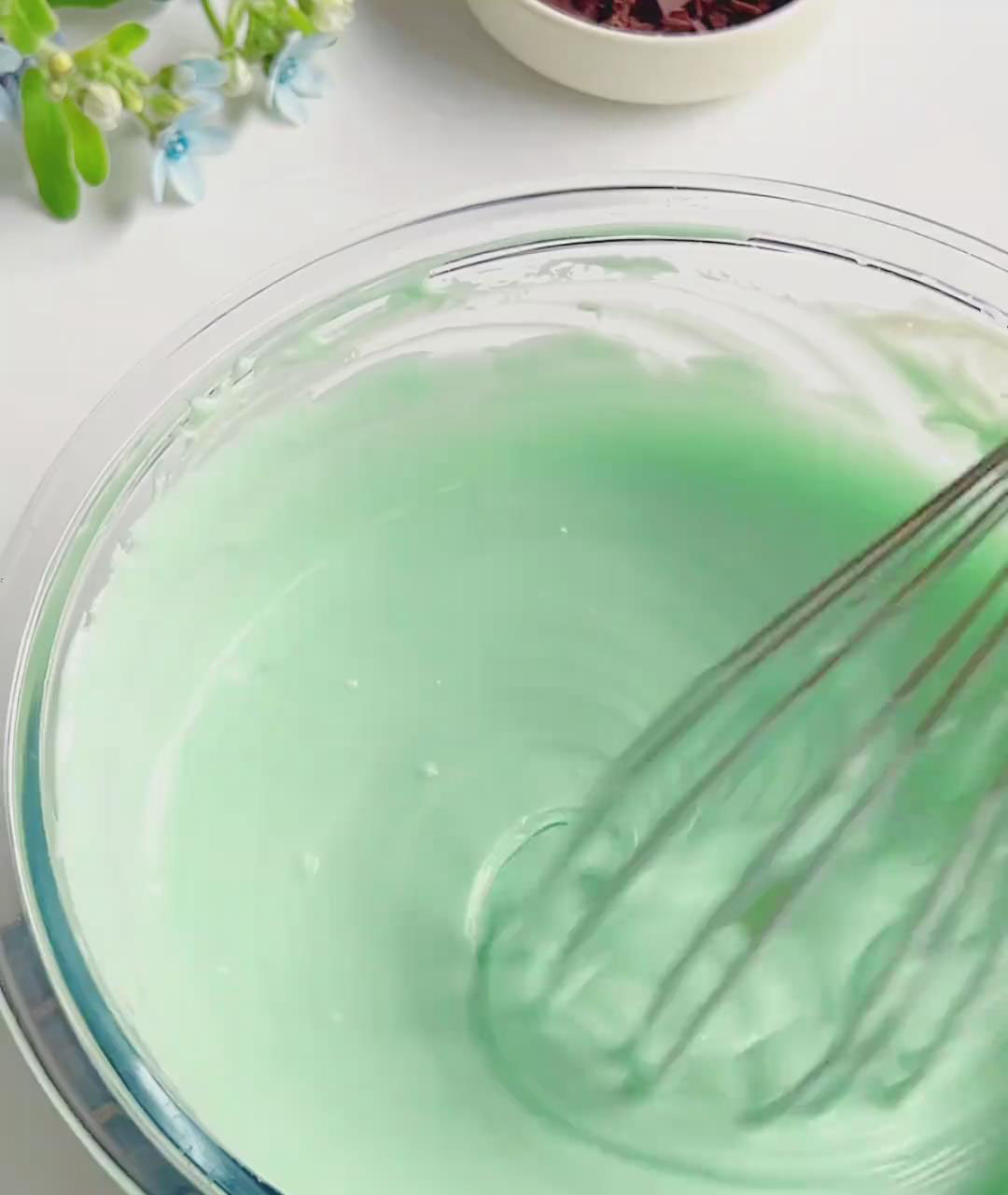 In a large bowl, whisk softened cream cheese, sugar, and mint syrup until smooth