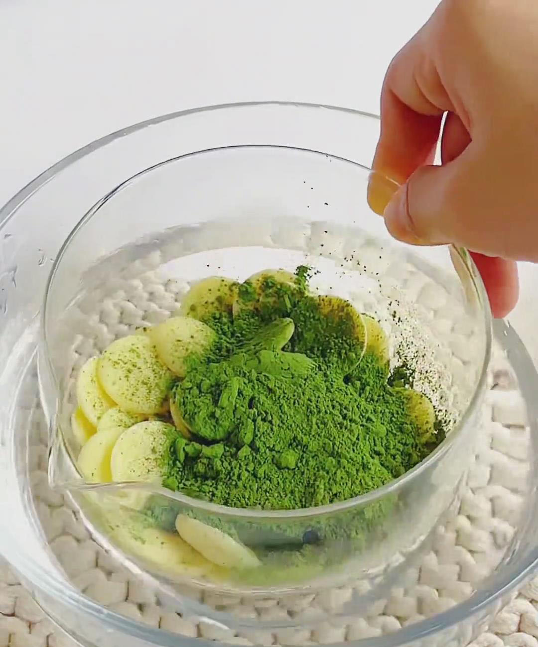 Melt 100g white chocolate with 15g sifted matcha powder using a double boiler
