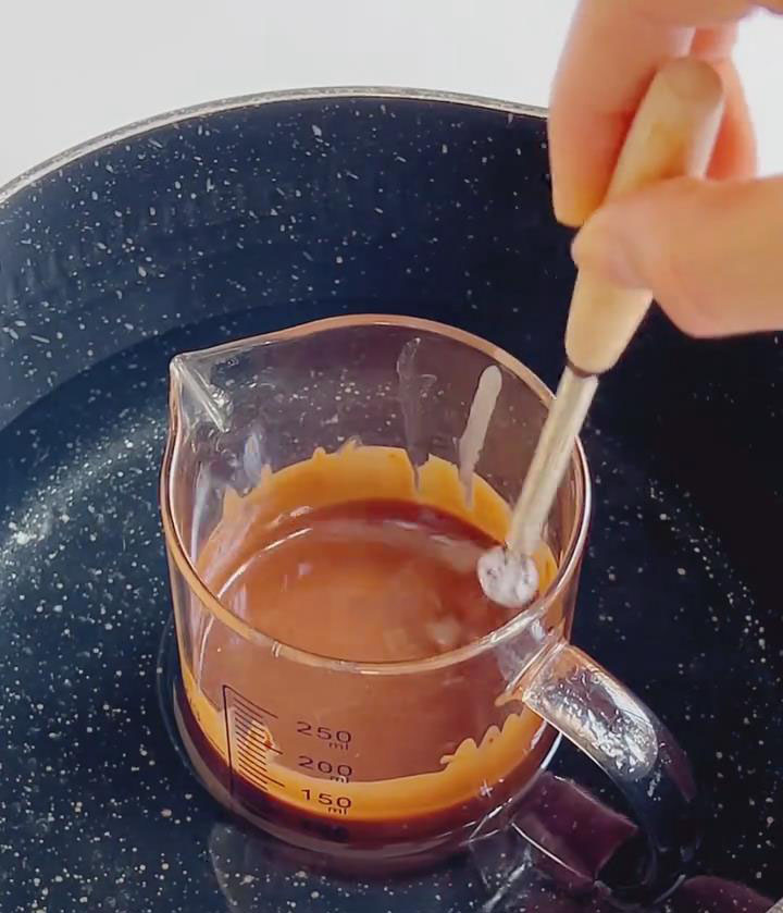 Melt 80g chocolate with 25g coconut oil over a hot water bath