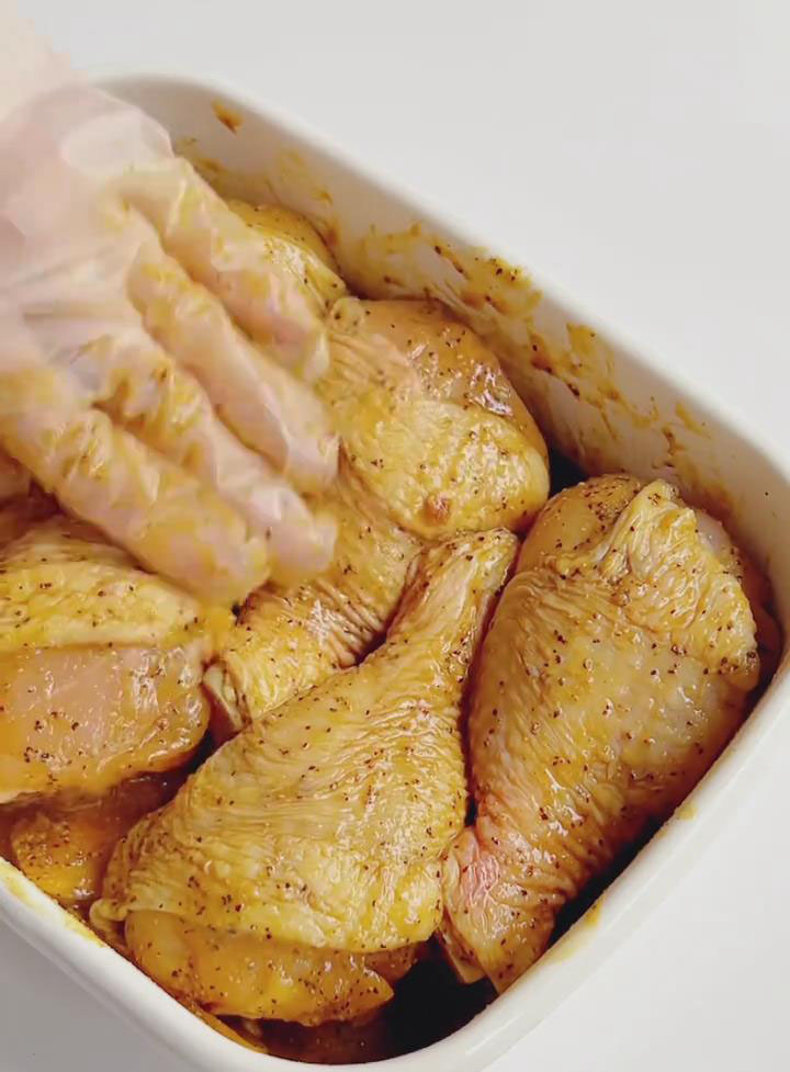 Mix with your hands until the chicken is evenly coated