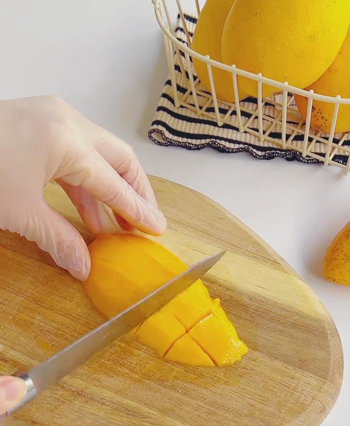 Peel mangoes, slice around the pit, and dice