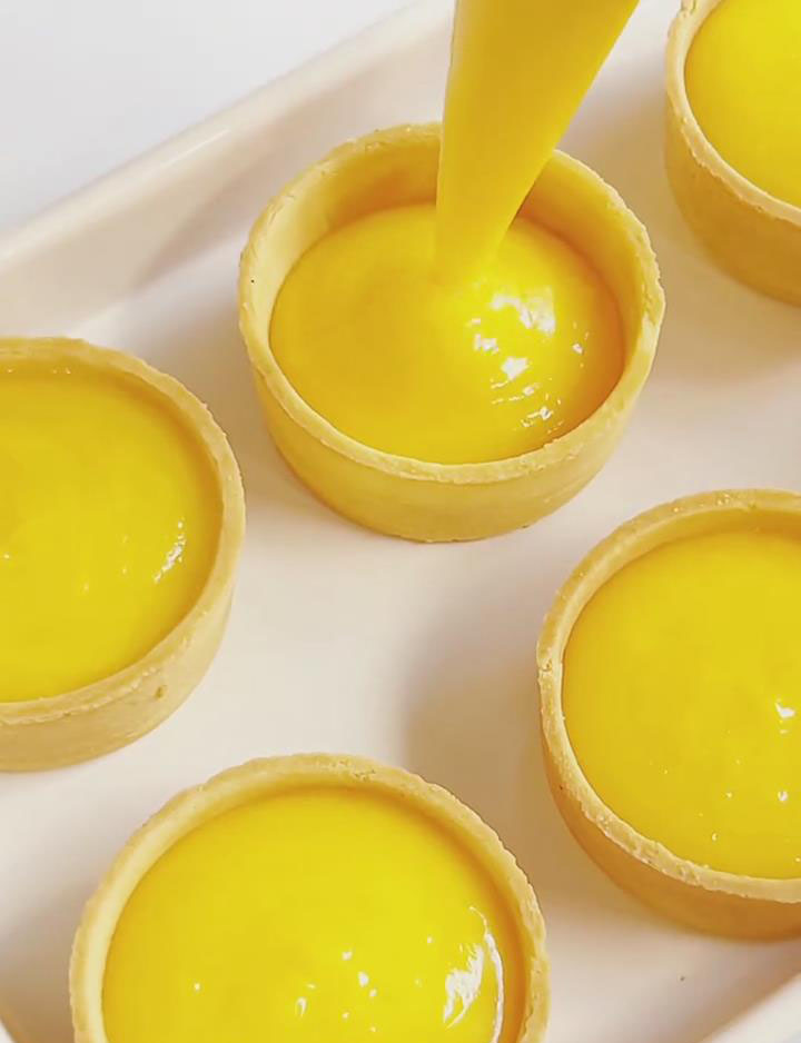 Pipe the lemon curd into the 6 pre made tart shells