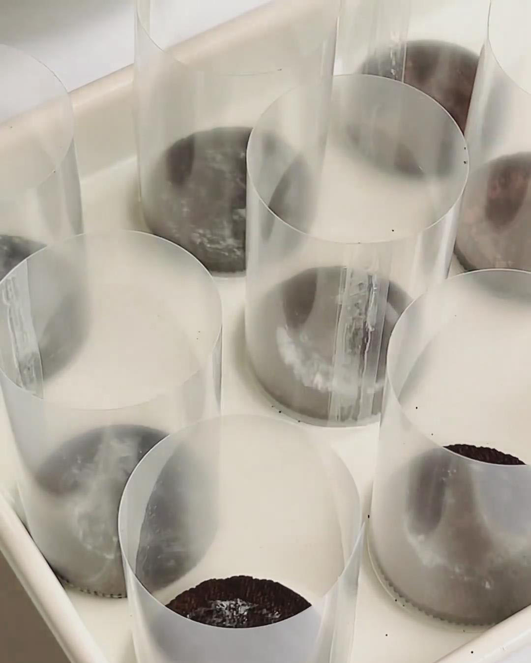 Place a layer of whole Oreo cookie shells at the bottom