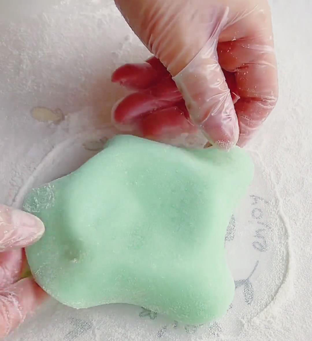 Place the rolled out mochi wrapper over the mold