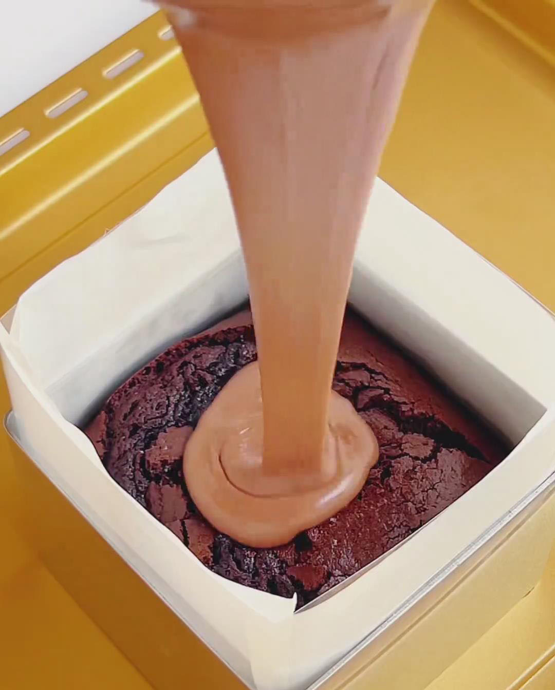 Pour mousse over cooled brownie base