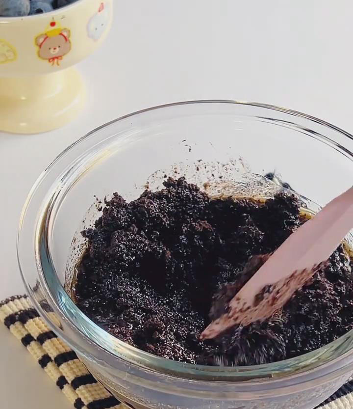 Quickly mix with a silicone spatula until every crumb is evenly coated with butter