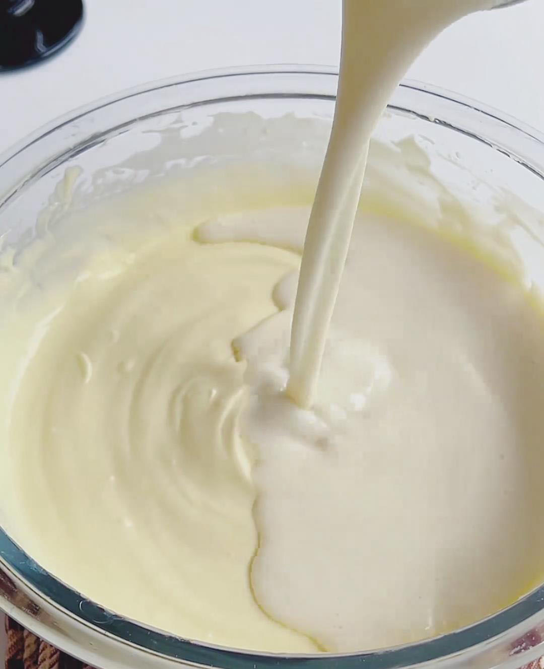 Slowly pour the gelatin milk mixture into the cream cheese base