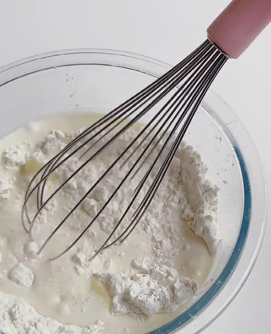 Slowly whisk in milk