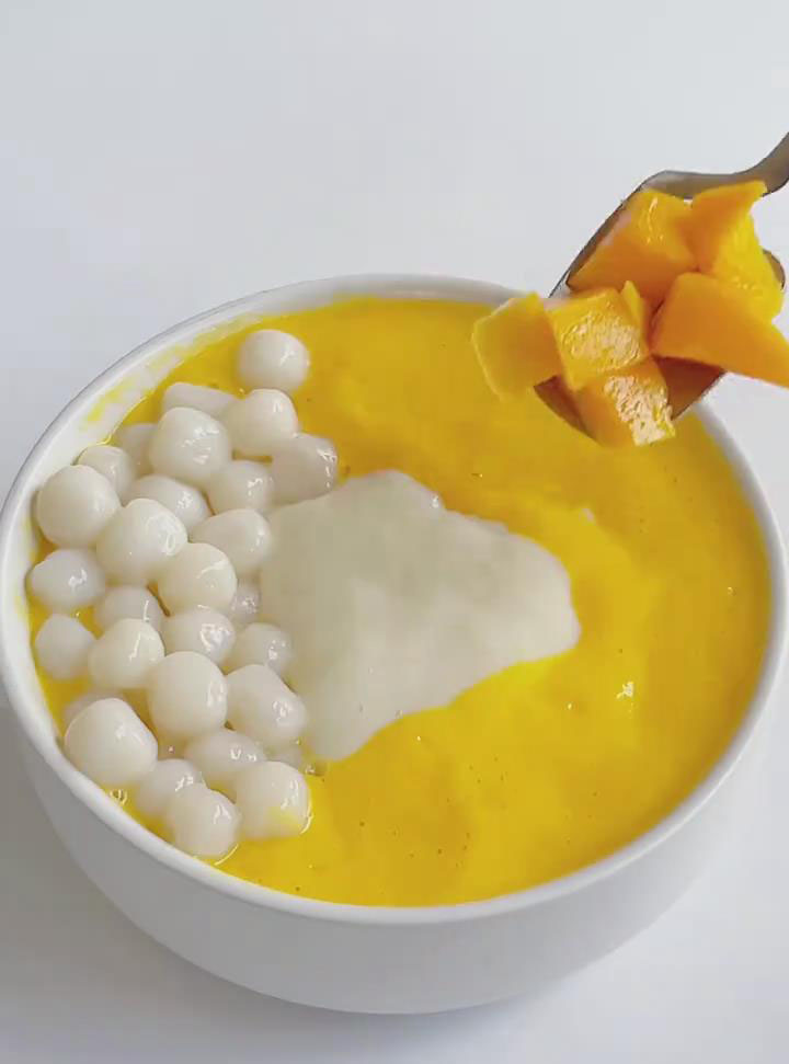 Stir in the rice balls and diced mango
