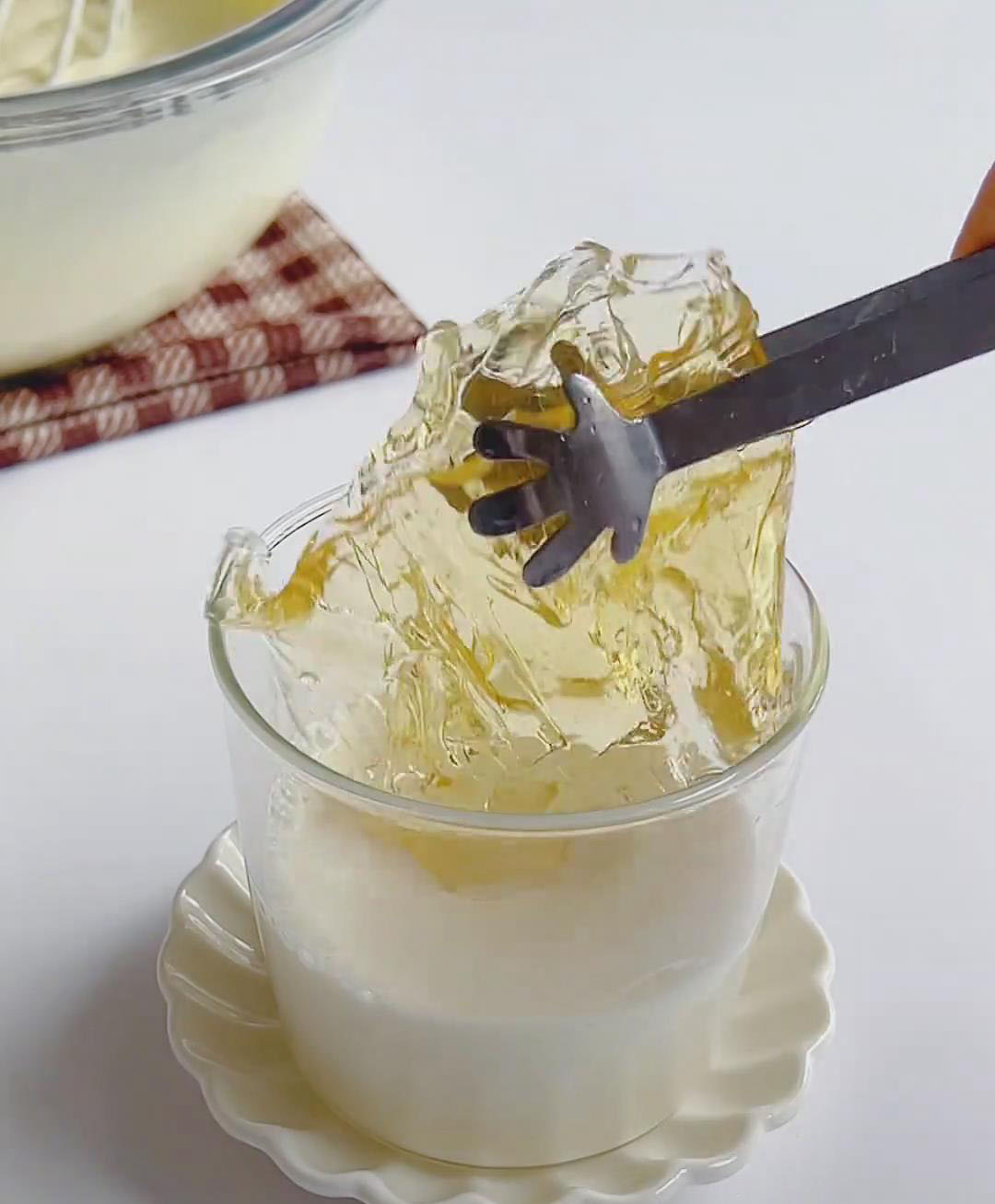 Stir softened gelatin into 60g hot milk until dissolved