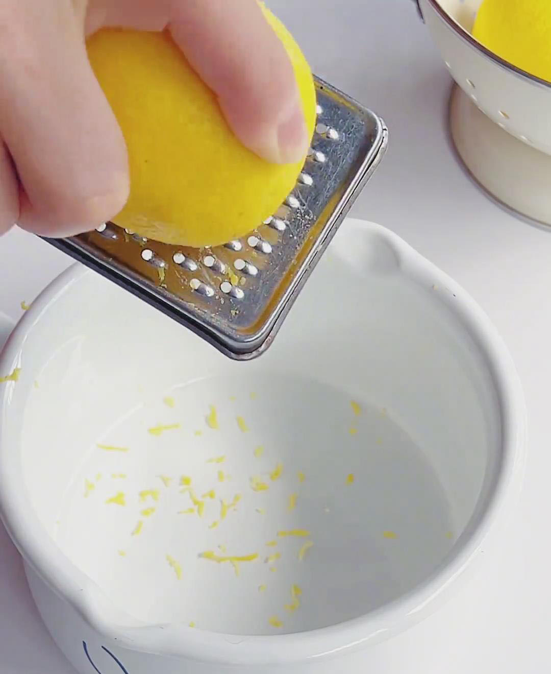 Use a fine grater to zest only the yellow part of the lemon skin