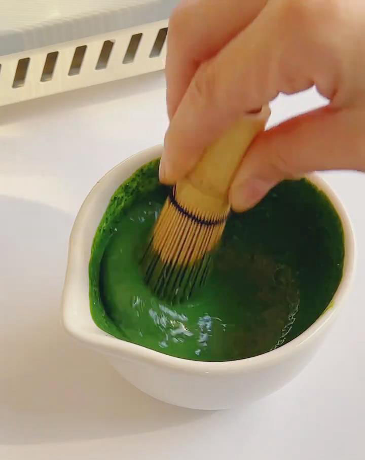 Whisk 10g sifted matcha with 25g hot milk until smooth