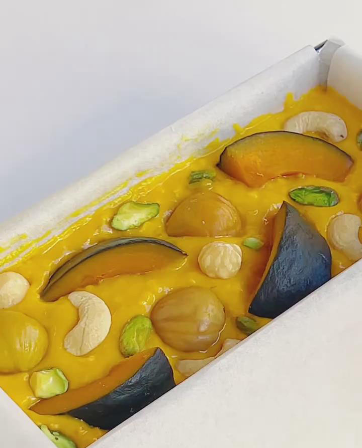 arrange the reserved 4 thin Kabocha slices, 3 4 whole chestnuts, and reserved chopped nuts on top of the batter