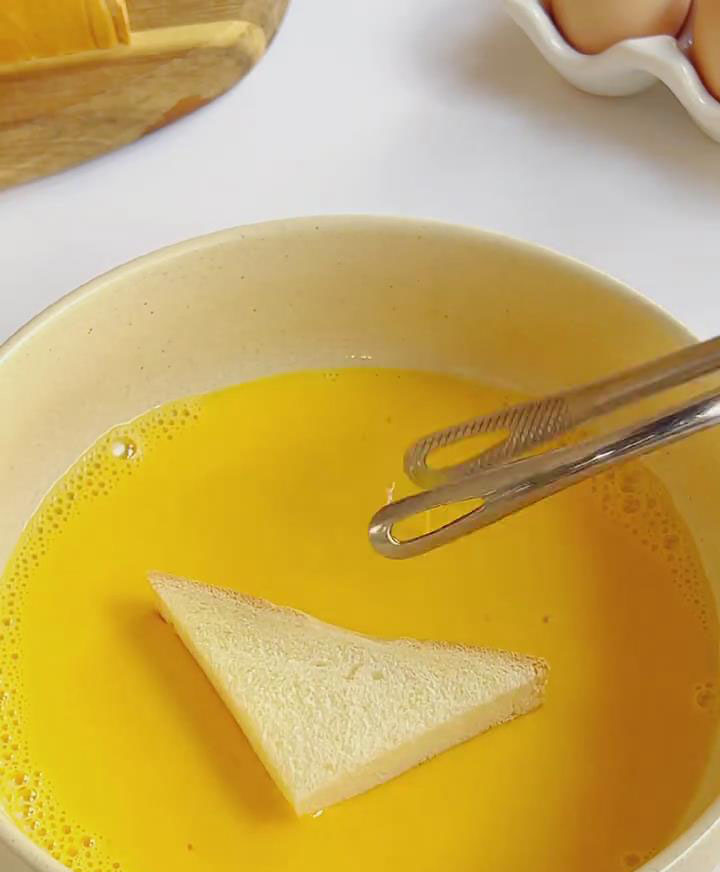 dip toast slices into the egg milk mixture