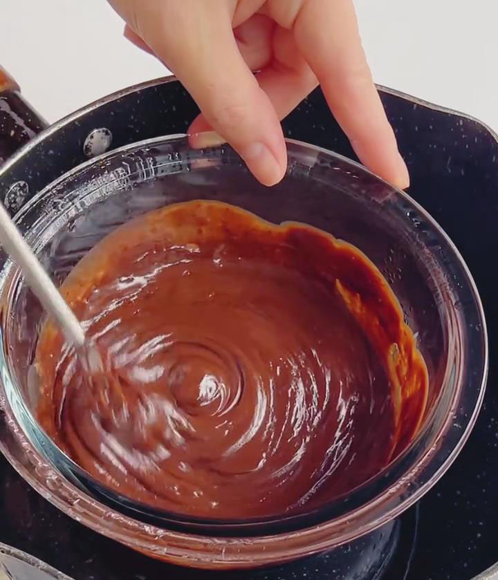 melt 150g chocolate with 100g cream over a hot water bath