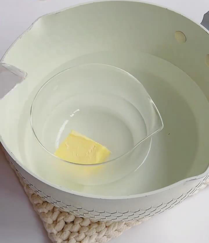 melt it in a small bowl over a hot water bath