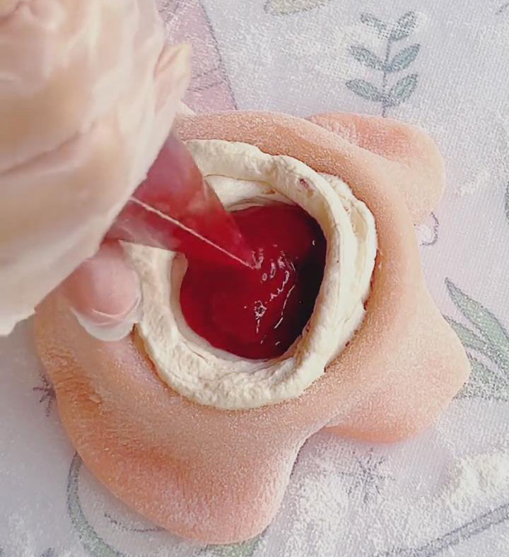 pipe a small dot of extra strawberry jam