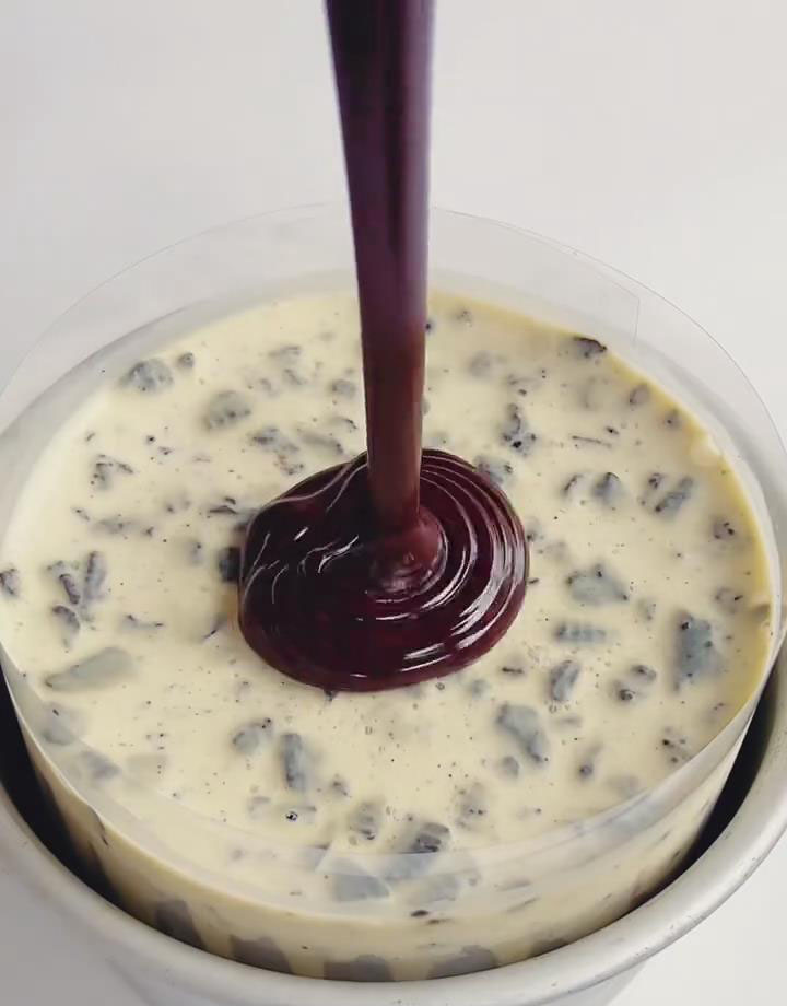 pour the cooled ganache over the top of the set cheesecake layer