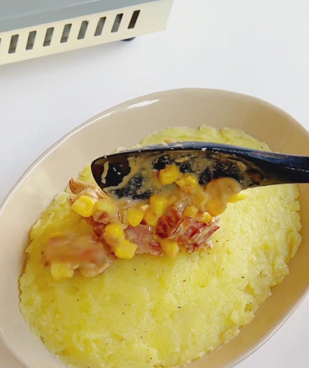 pour the prepared bacon cream sauce over the mashed potatoes