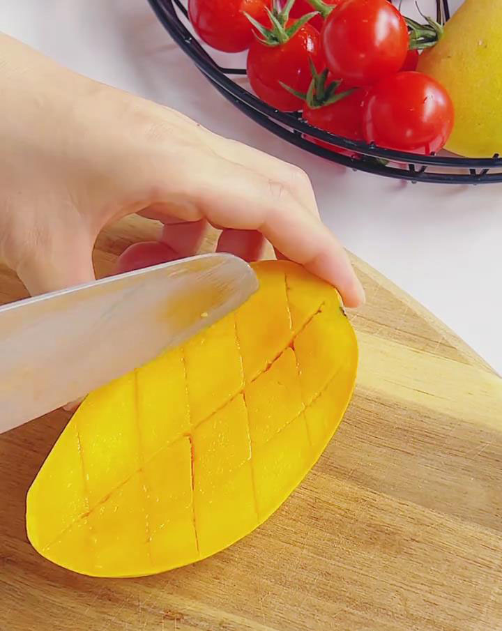 score mango flesh into cubes