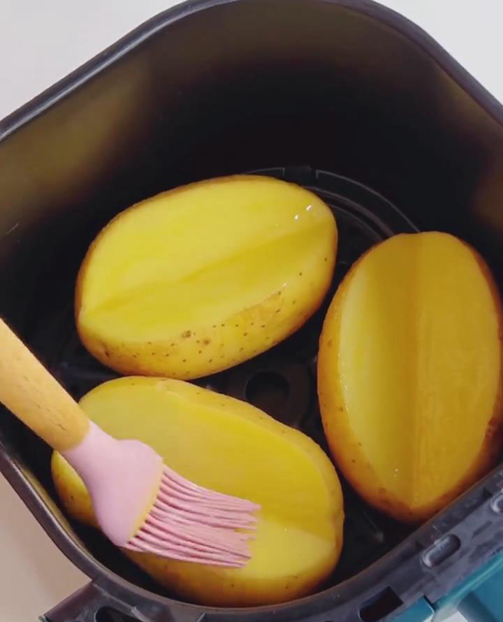 silicone brush to evenly apply melted butter over the potato surface