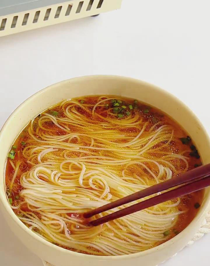 transfer the cooked noodles to the broth bowl