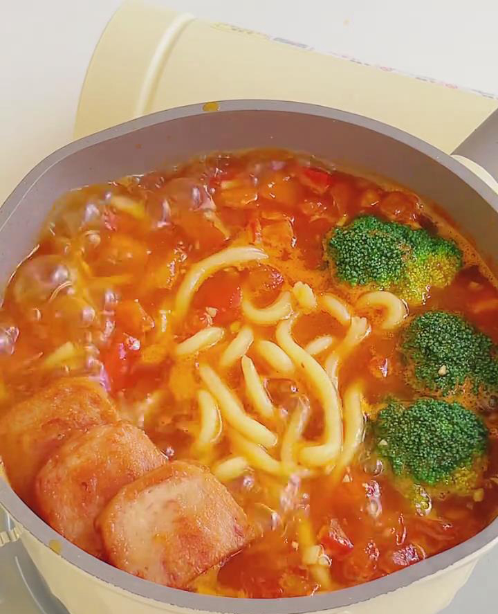 Add the broccoli and fried luncheon meat