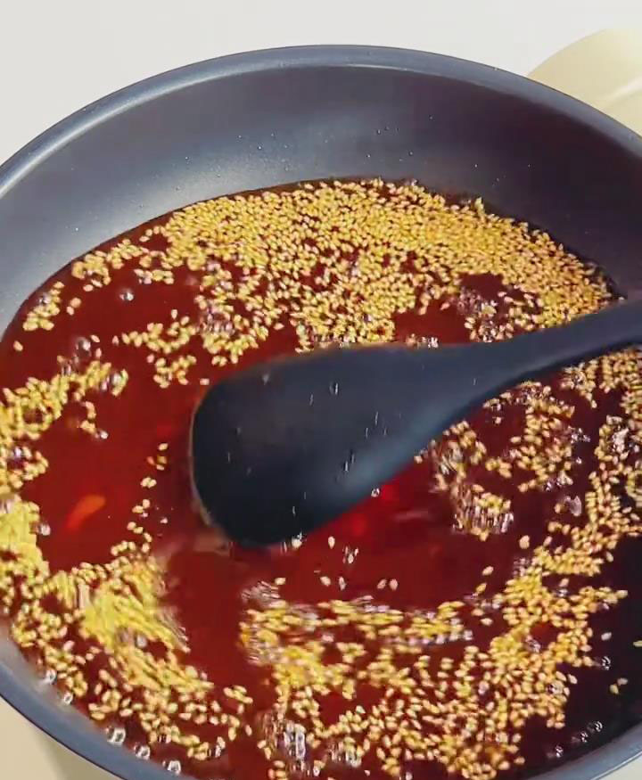 Heat the sauce in a wok over medium low heat without oil