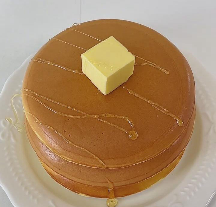 Add a small piece of butter on top to melt from residual heat and drizzle with honey