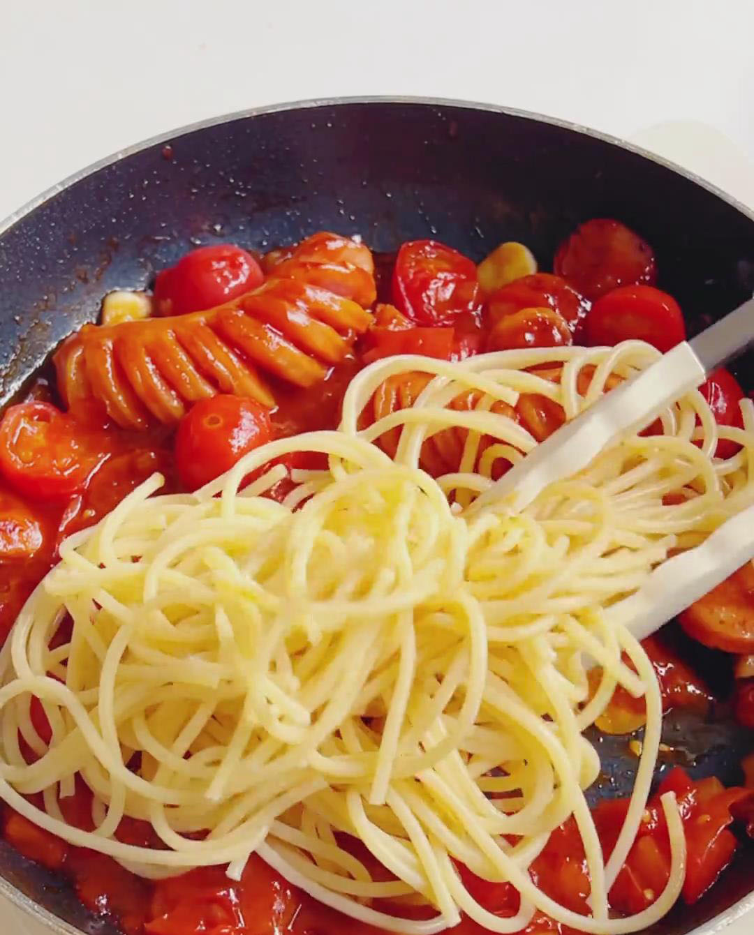 Add the cooked pasta to the pan
