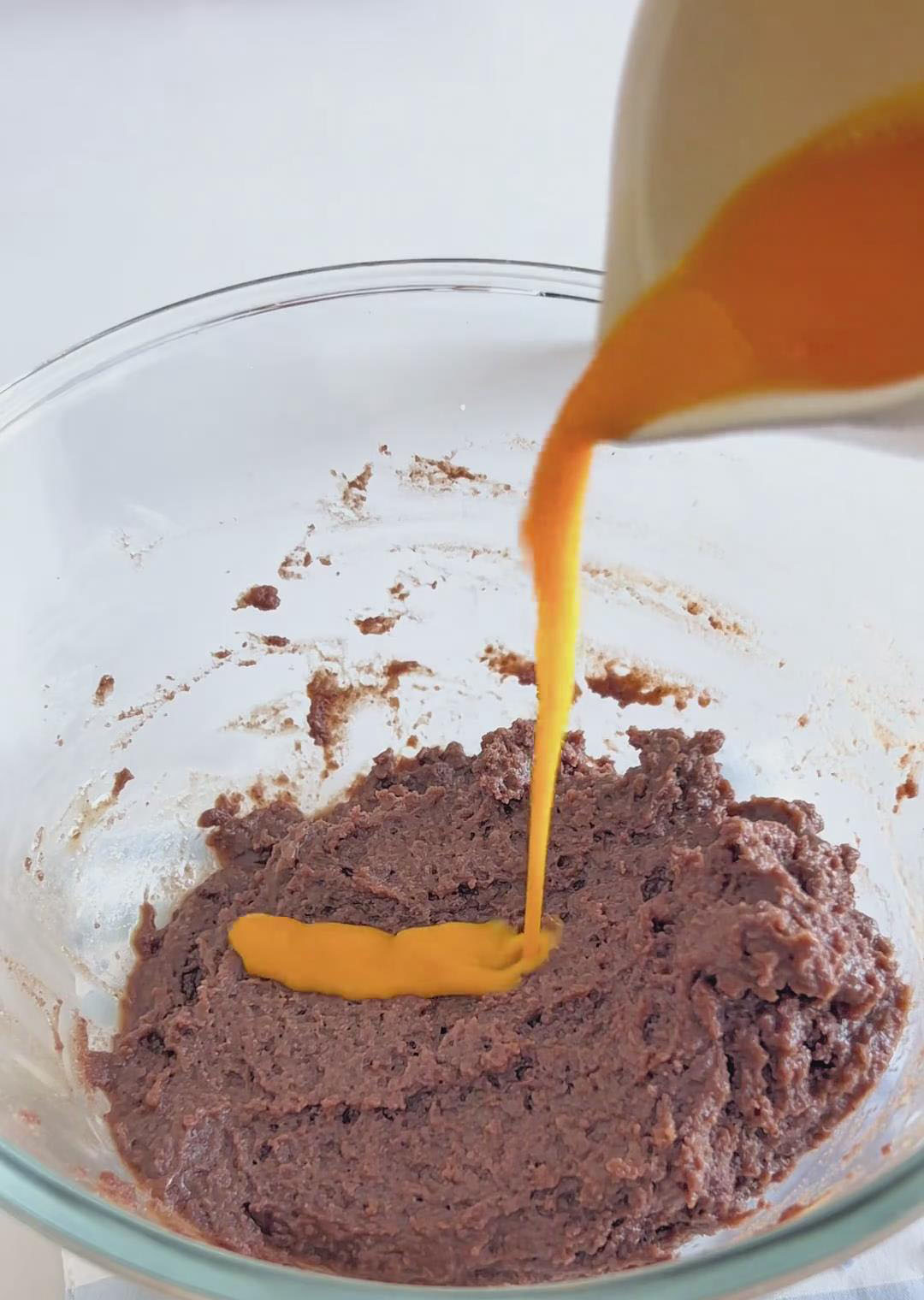 Beat the eggs and add them in 3–4 additions