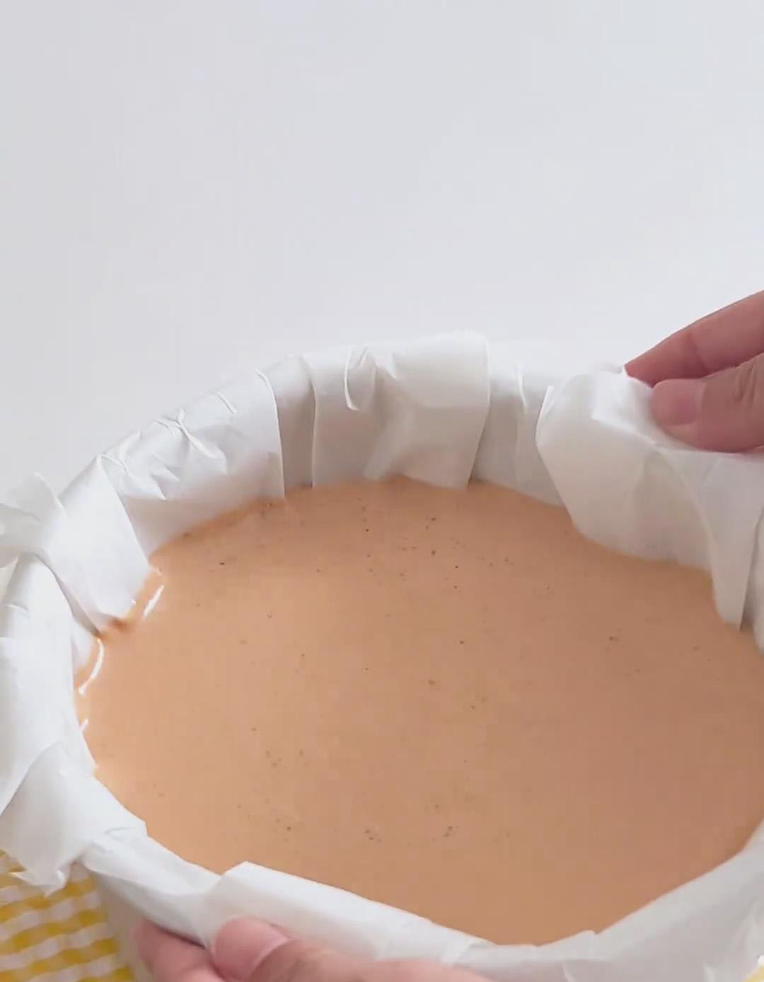 Hold the pan with both hands and gently tap it