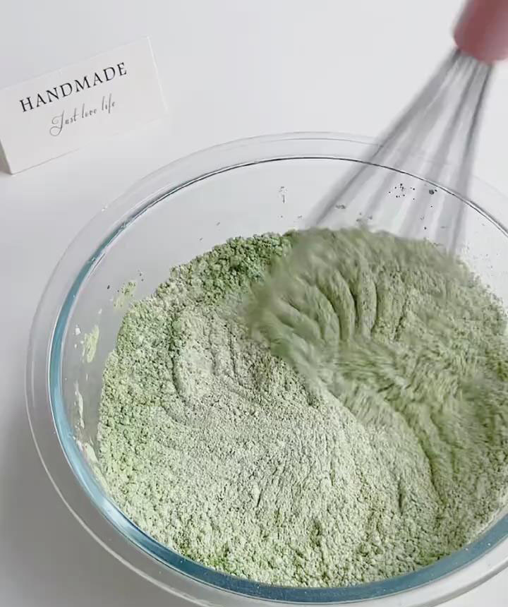 In a large mixing bowl, whisk together the glutinous rice flour, cornstarch, matcha powder, and sugar