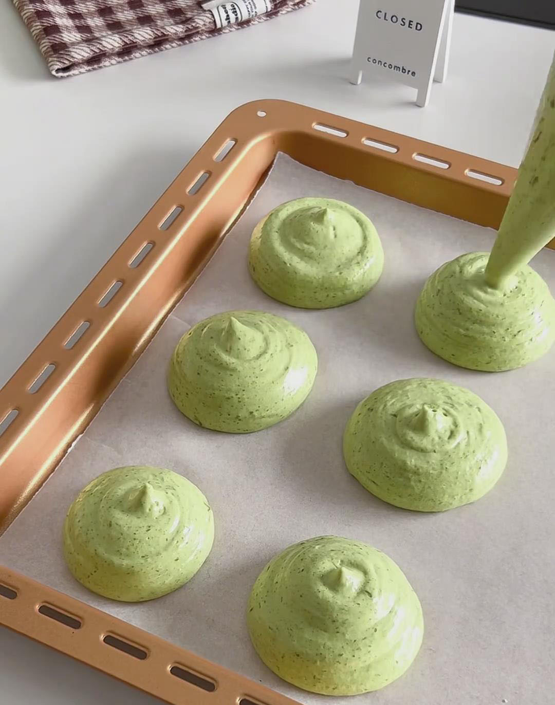 Pipe small, evenly sized rounds (about 5cm in diameter) onto the prepared baking sheet