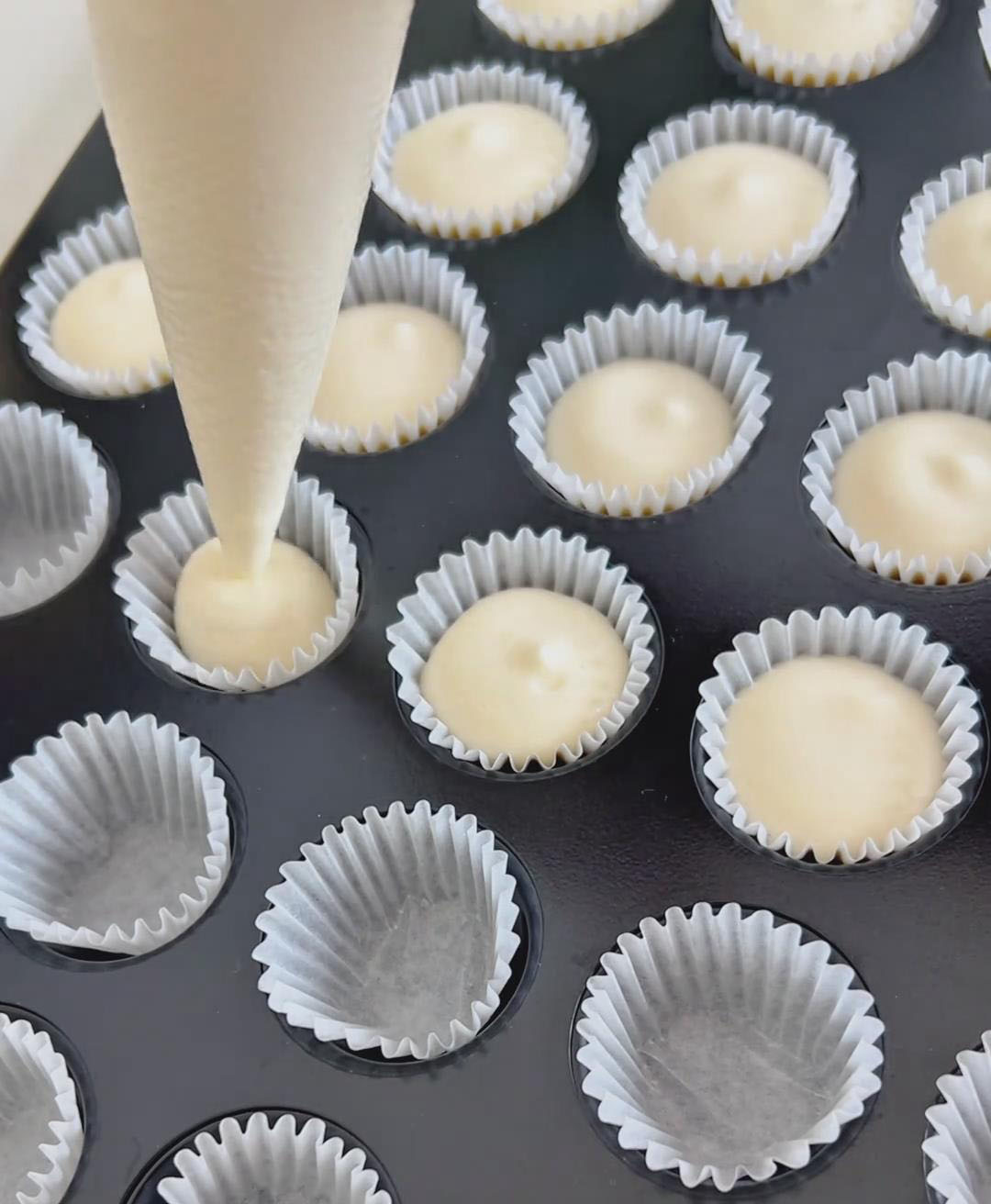 Pipe the batter into the prepared mini cupcake liners