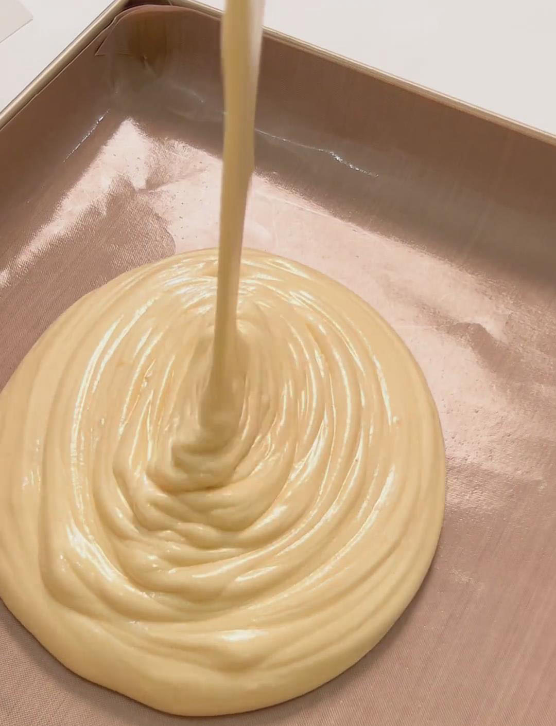 Pour the batter into the lined tray