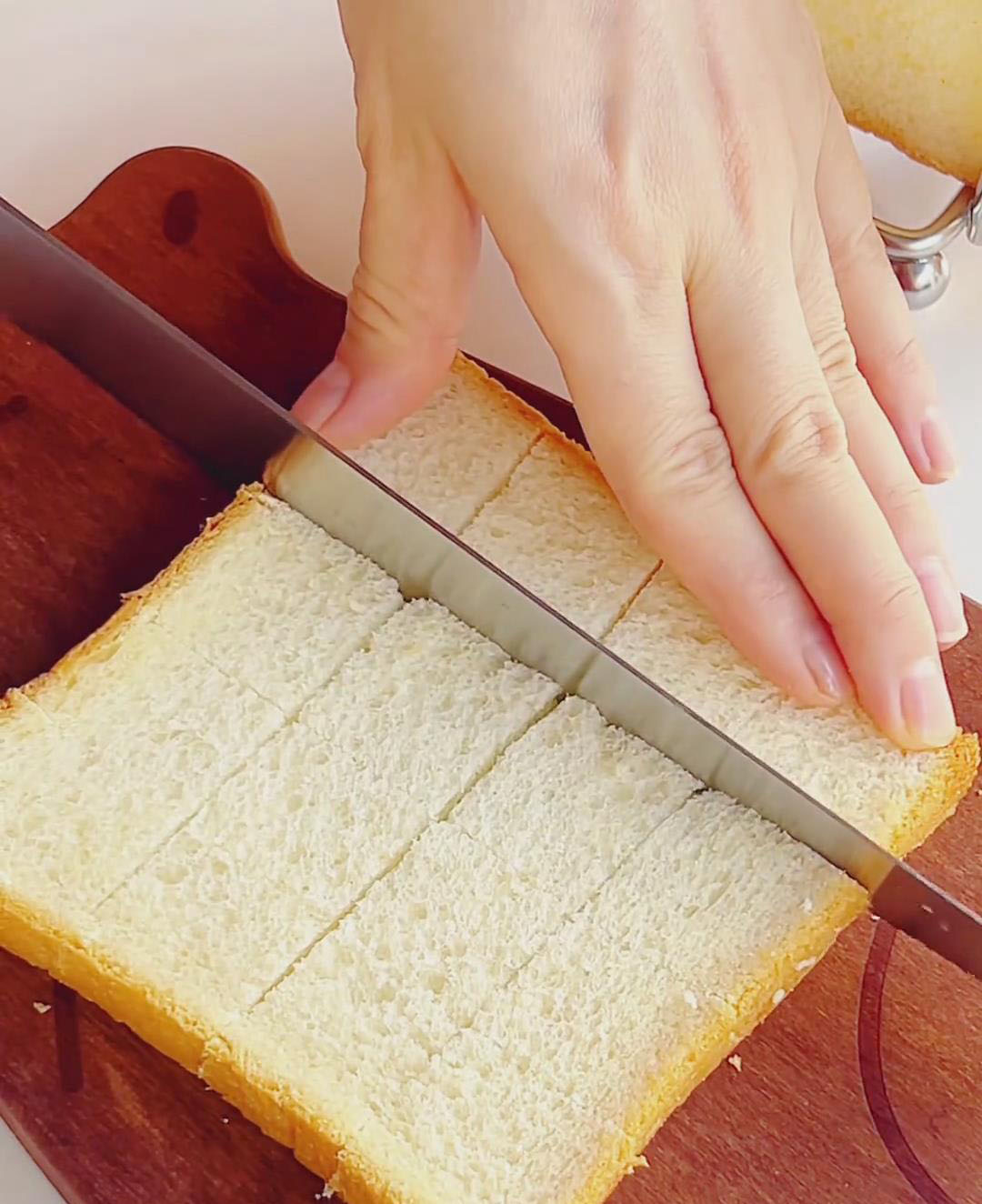Take each slice of bread and score it lightly — cut across both directions